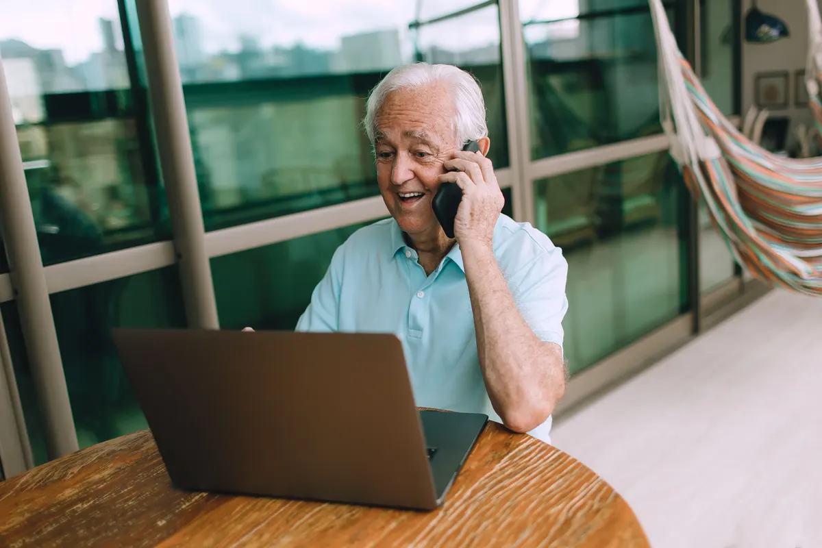 Hand picking up a desk phone handset
