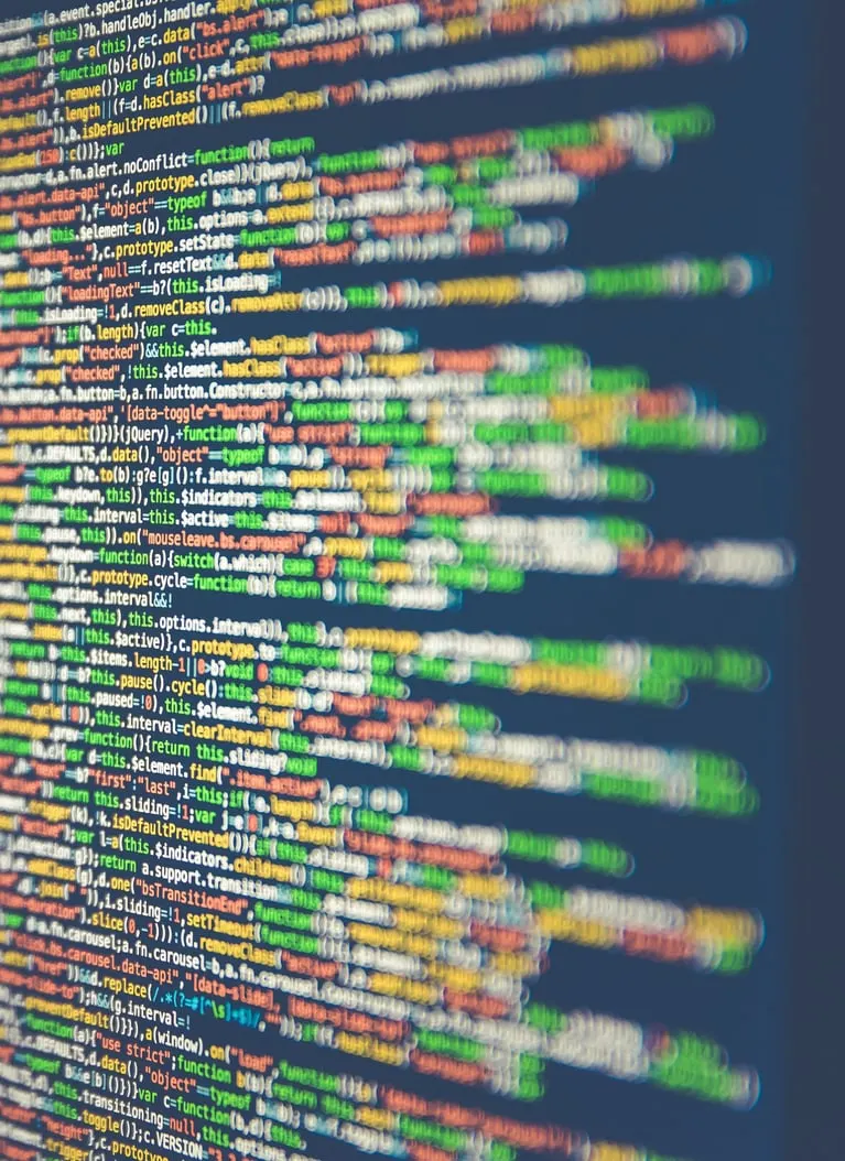 Close-up of colourful lines of code on a screen