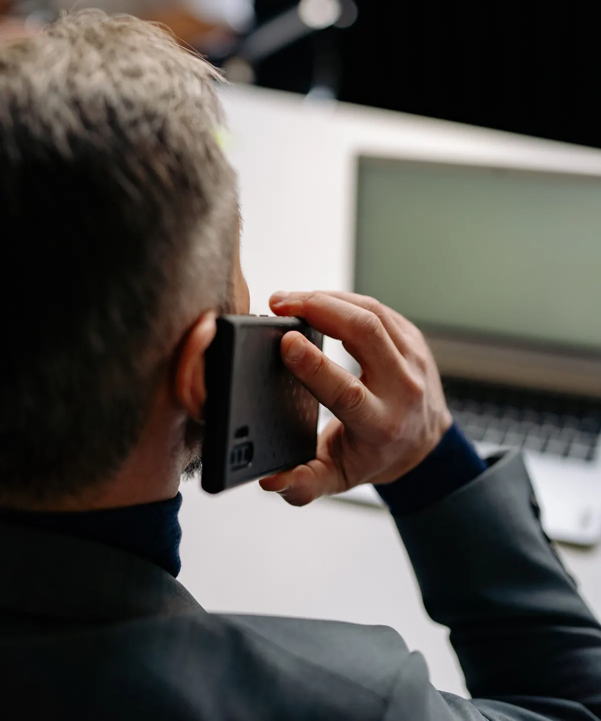 Call centre team working at their desks with headsets