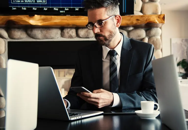 Financial advisor reviewing paperwork at a desk