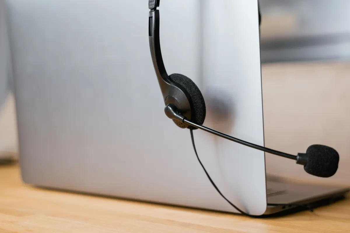 Close-up of a headset resting on a laptop
